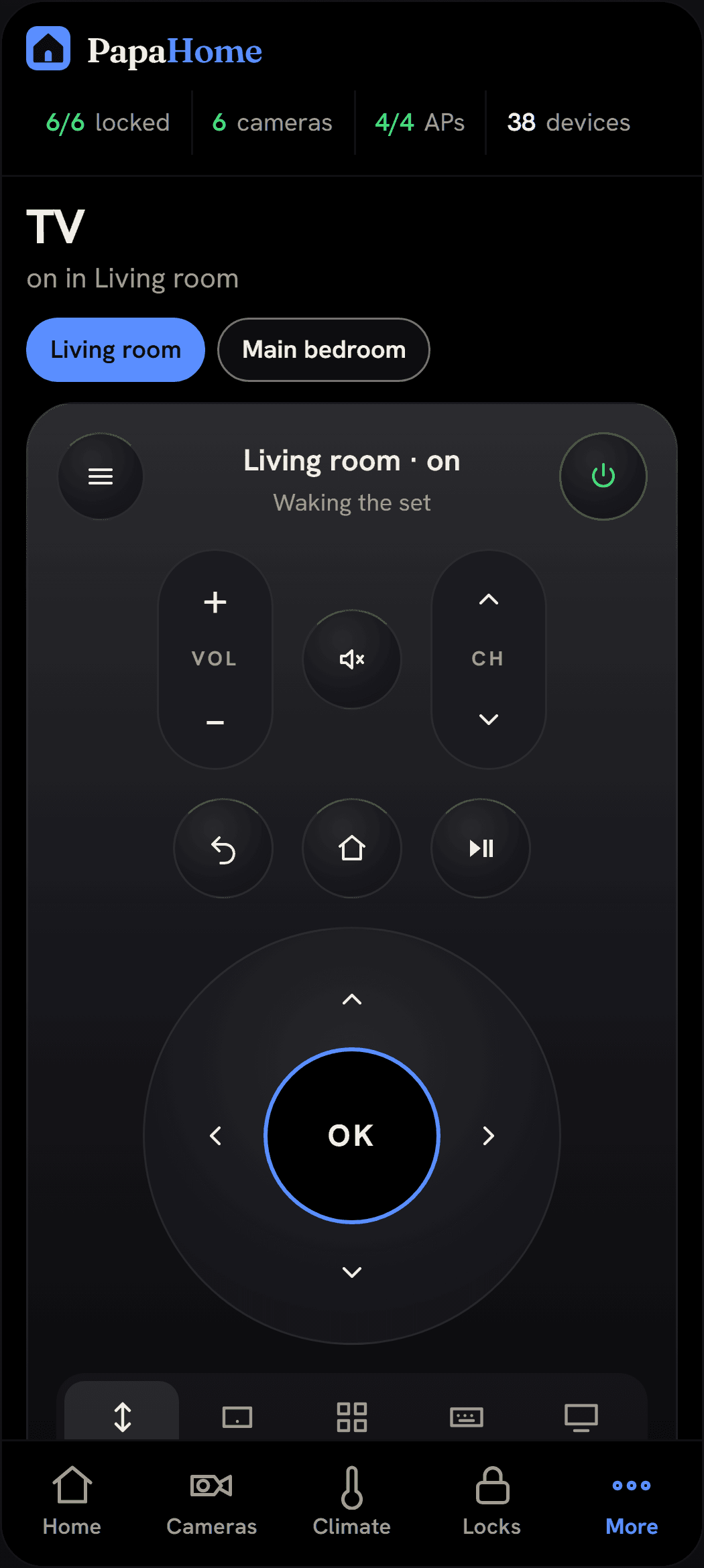 A television's remote on a phone: power, volume and channel, mute, back, home and play, a direction pad with OK, and tabs for touchpad, apps, keyboard and inputs